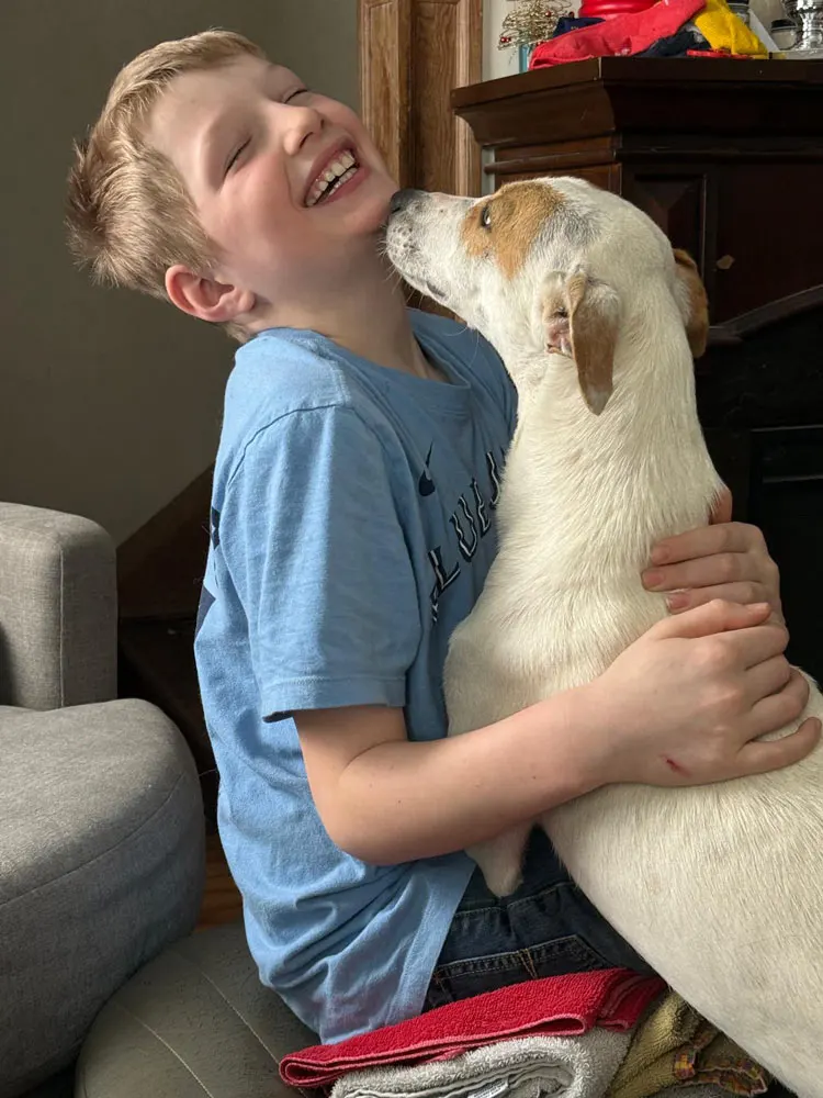 Furst Responder Animal Rescue - image of one of the adopted dogs with the family who adopted it. 